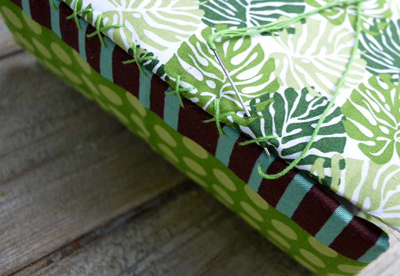 Sew up the fronts and sides of the tropical fabric birdhouses, using 