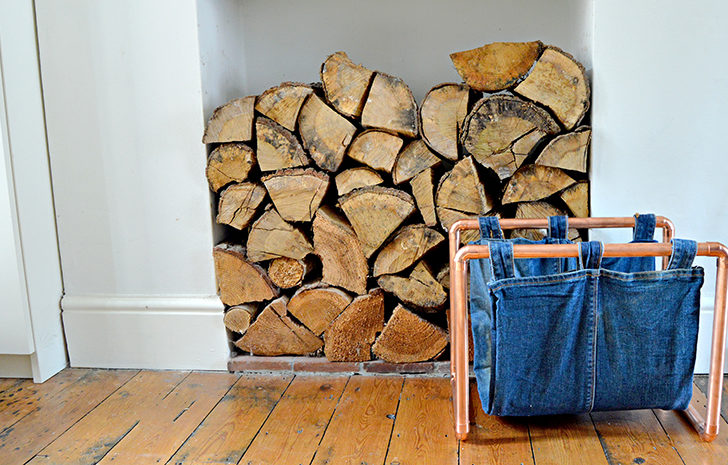 How to make a trendy DIY magazine rack with an old pair of jeans and some copper pipping.