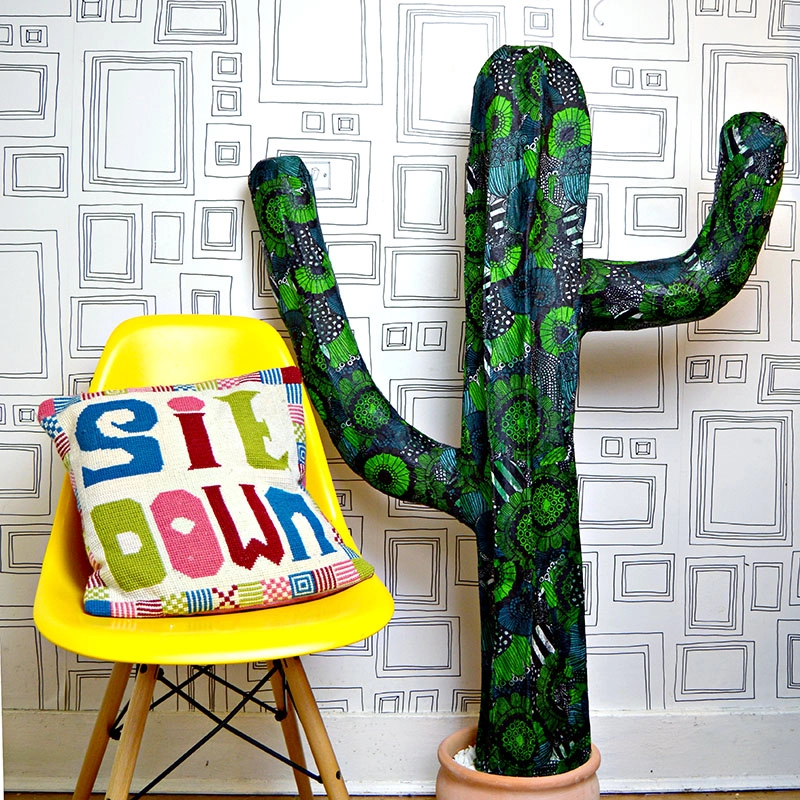 It's easy to make your own giant paper mache cactus. You can even pimp it with Marimekko napkins.