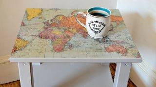 Upcycle a boring Ikea table with a world map and turning it into a fantastic map table.