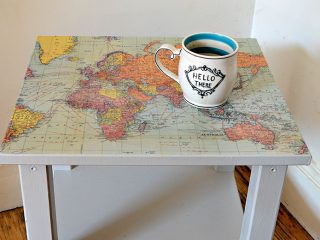 Upcycle a boring Ikea table with a world map and turning it into a fantastic map table.