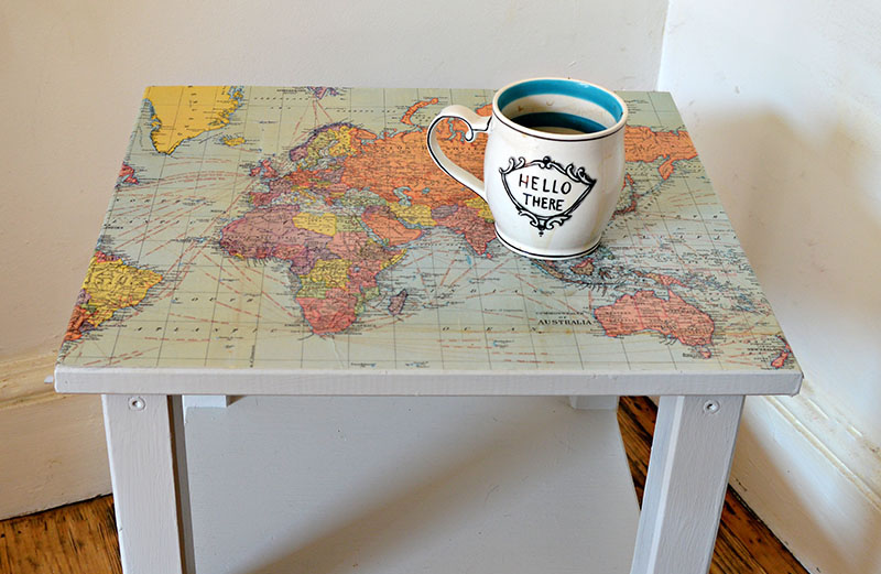 Upcycle a boring Ikea table with a world map and turning it into a fantastic map table.