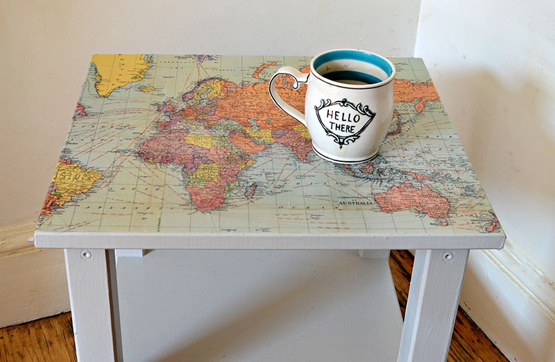 Upcycle a boring Ikea table with a world map and turning it into a fantastic map table.
