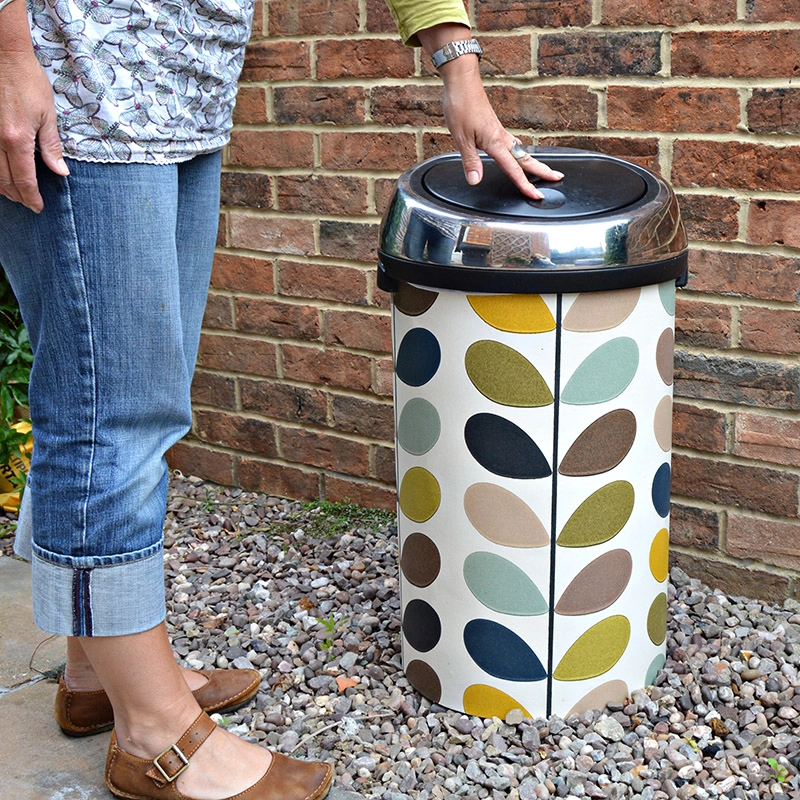 Upcycle  kitchen bin with wallpaper.  This bin was transformed with some Orla Kiely multi stem wallpaper.  No longer need to hide it in the corner the bin is now a feature & no one else will have one like it. Full tutorial.
