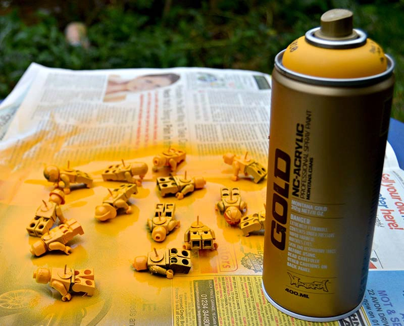 LEGO push pins and yellow spray paint
