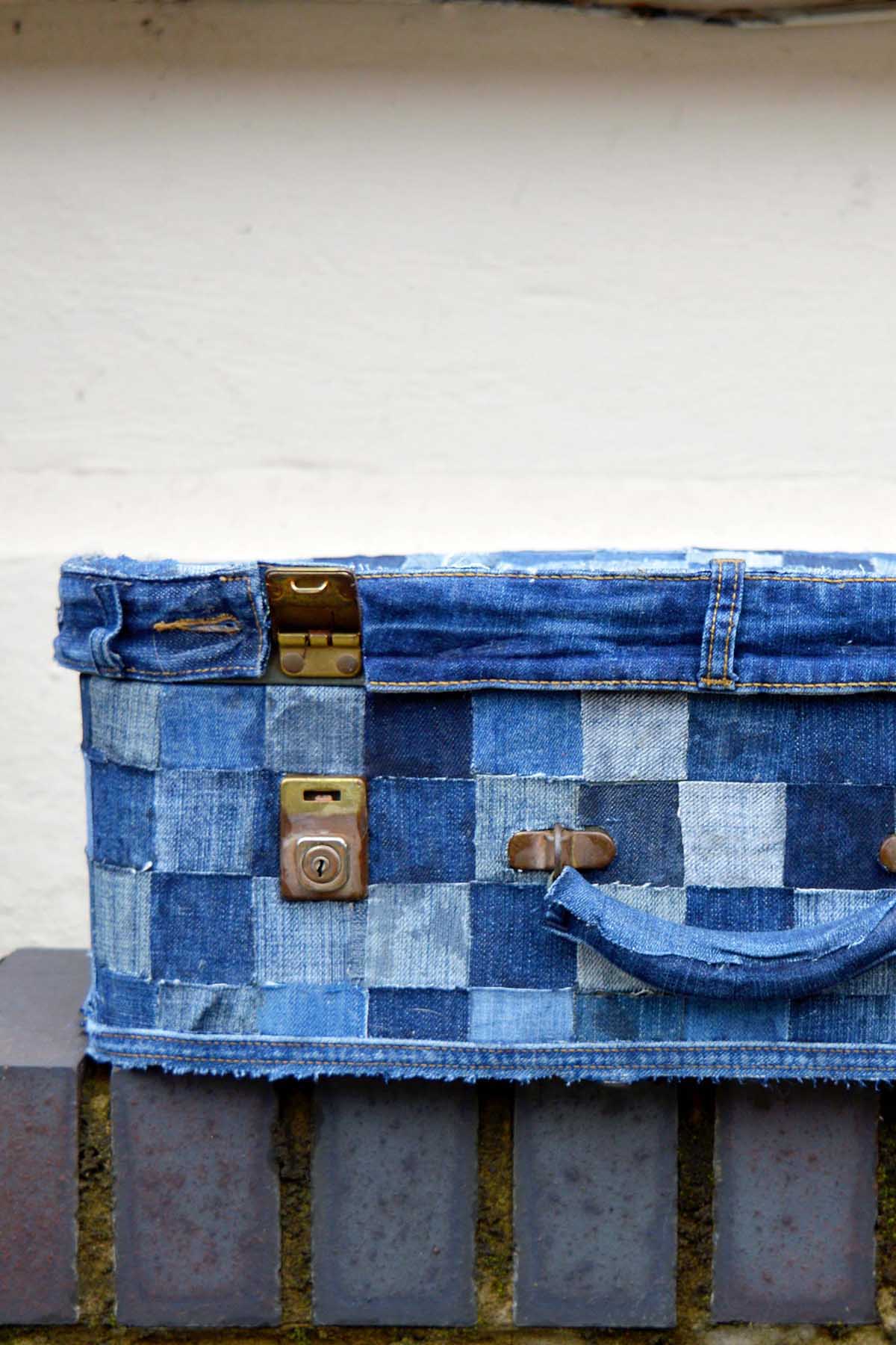 denim suitcase on wall