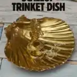 gold scallop jewellery dish with seahorse