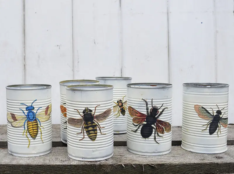 Decoupaged tin cans for upcycled window