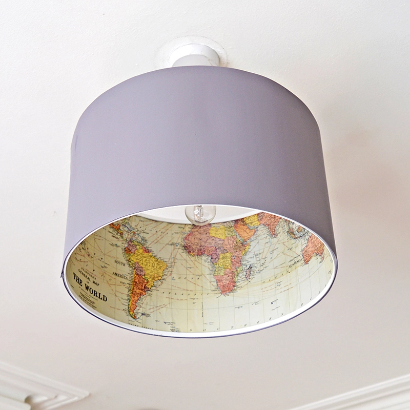 Ikea lamp hack - Decoupage a world map on the inside of an Ikea Rismon lamp to turn it into something special.