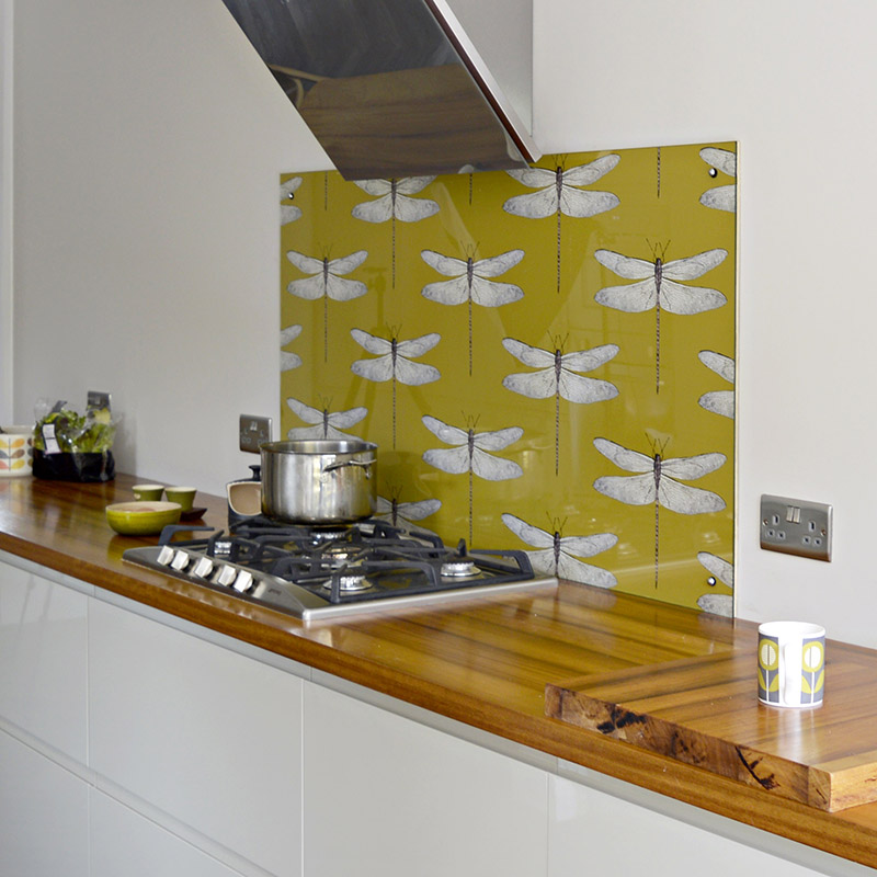 fitting the glass and wallpaper kitchen backsplash