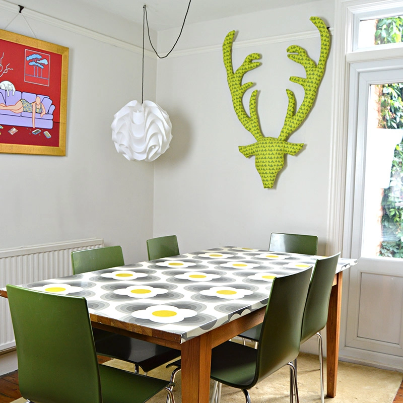 Creative uses for wallpaper - Make your dining table a feature of your home by wallpapering it.