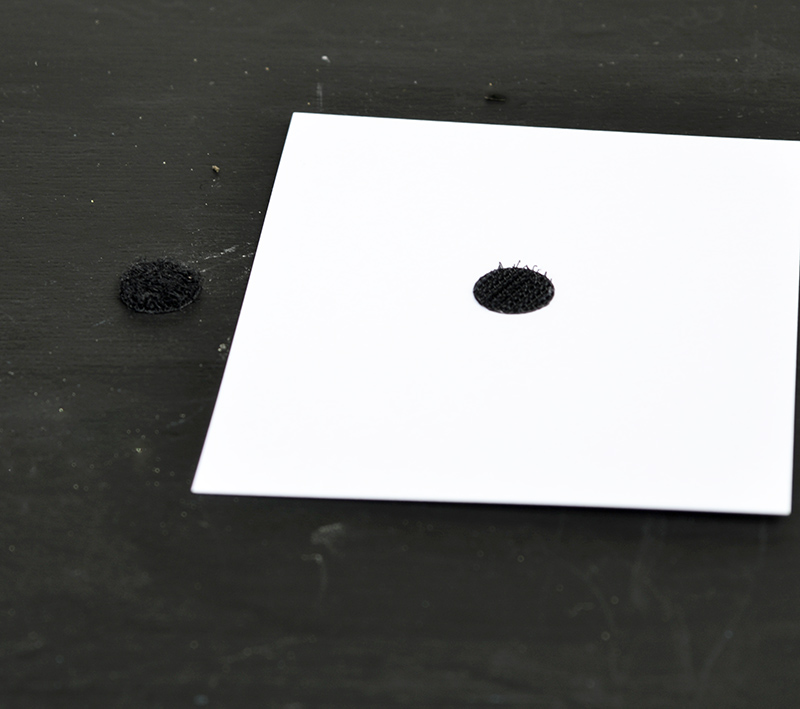 adding velcro dot to back of photo