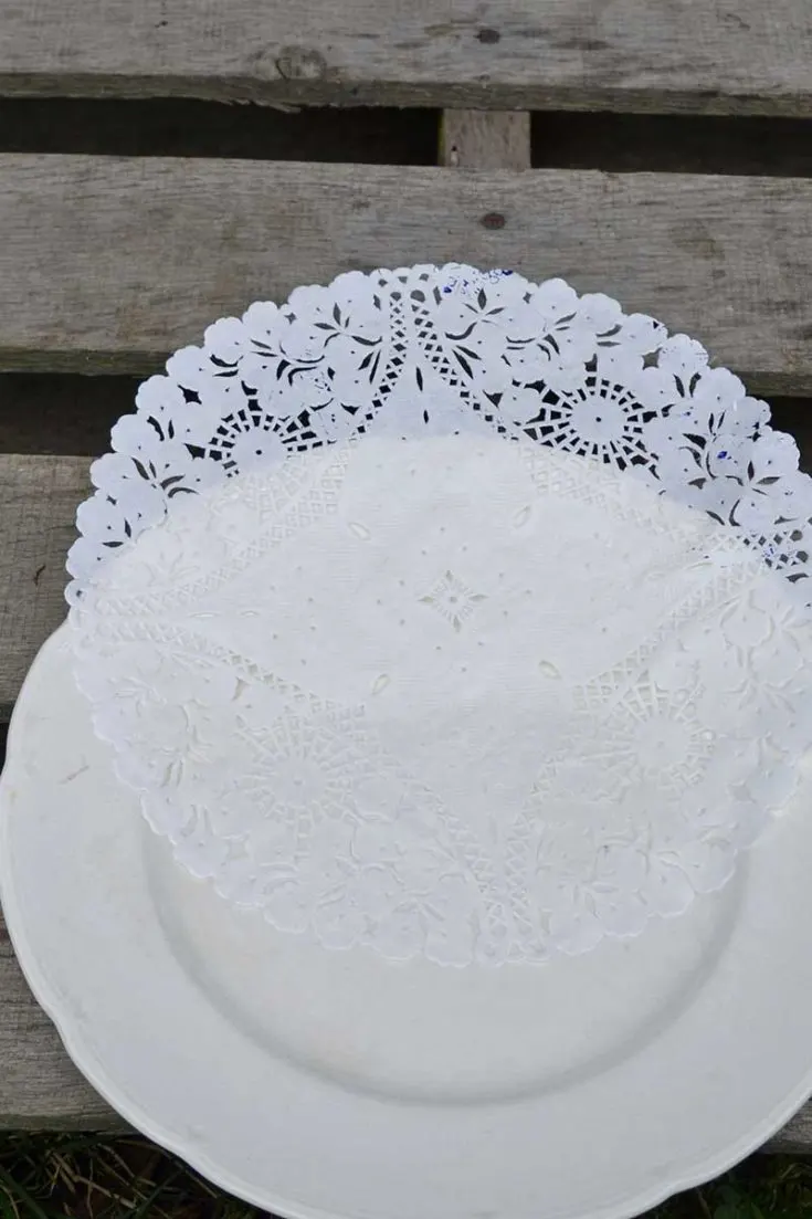 Placing doily stencil on plate