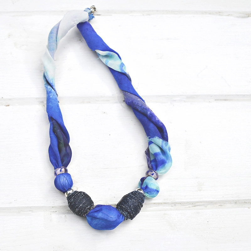 DIY Jewelry by upcycling old scarfs and making denim beads. Makes a great gift.