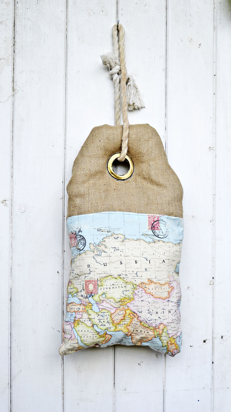 This map burlap pillow looks like a luggage tag. It even has writing on the other side which can be personalized. Full tutorial