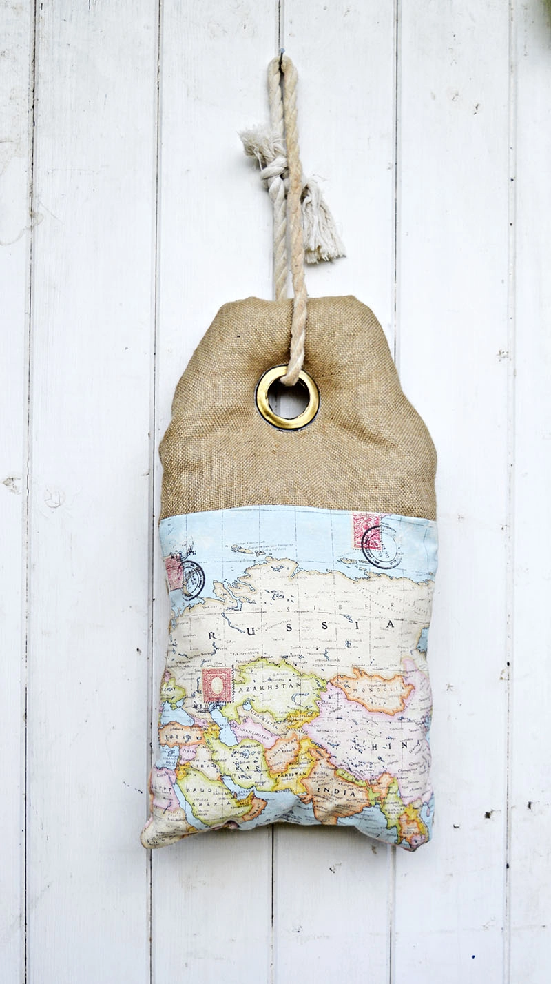 This map burlap pillow looks like a luggage tag. It even has writing on the other side which can be personalized. Full tutorial