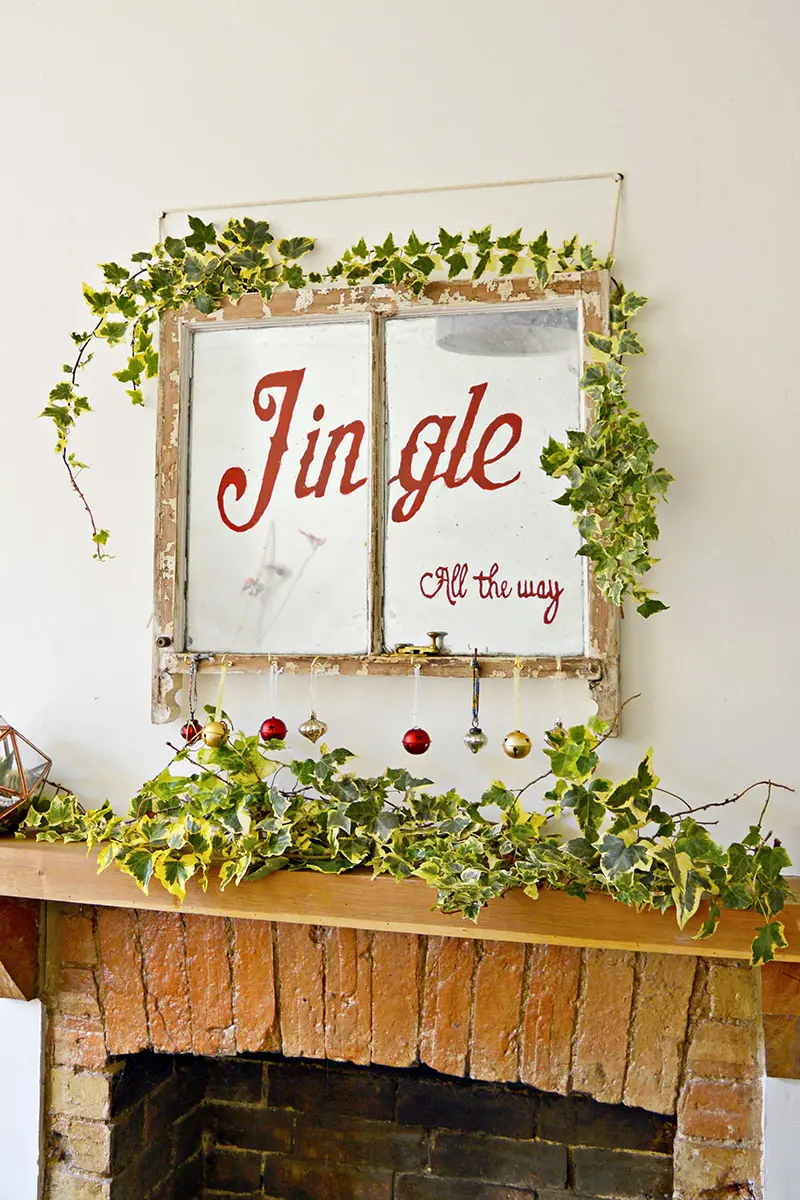 Old window Christmas decoration:  turn an old window into an antique mirror and lovely Christmas decoration for that vintage Christmas look.