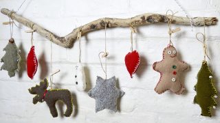 These are super cute upcycled Christmas ornaments. Made with old sweaters and cookie cutter shapes. Make for a lovely Christmas wall decoration.