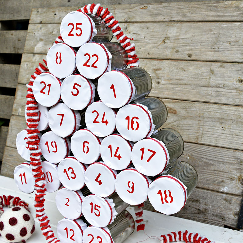 Make a rustic farmhouse style advent calendar for Christmas by upcycling your old tin cans.
