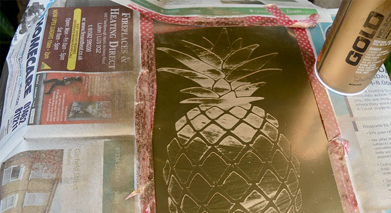 Spray painting the pineapple gold