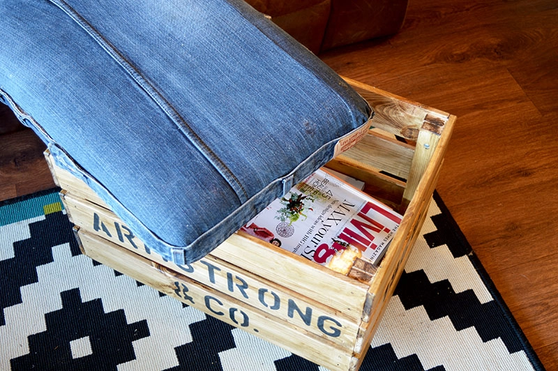 DIY Ottoman from upcycled jeans and an Ikea crate.  Makes for handy storage too!