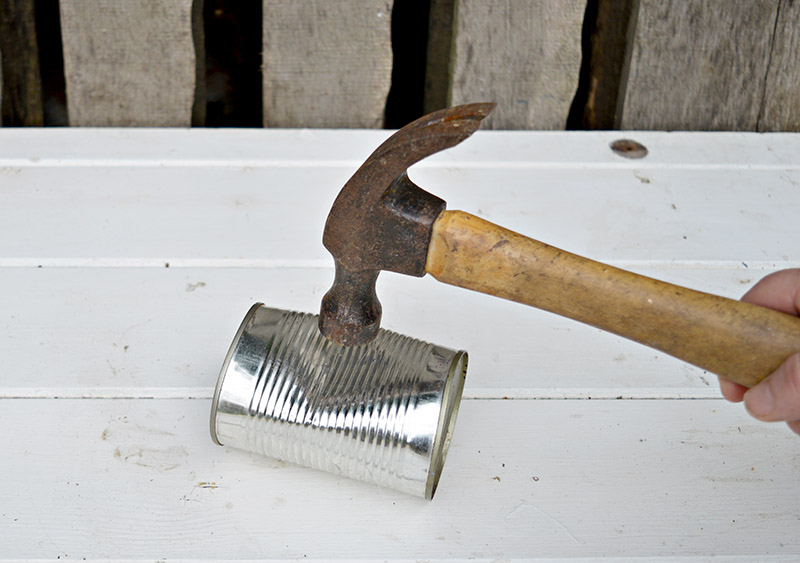 Crushing cans for shabby glam tin can diy planters.