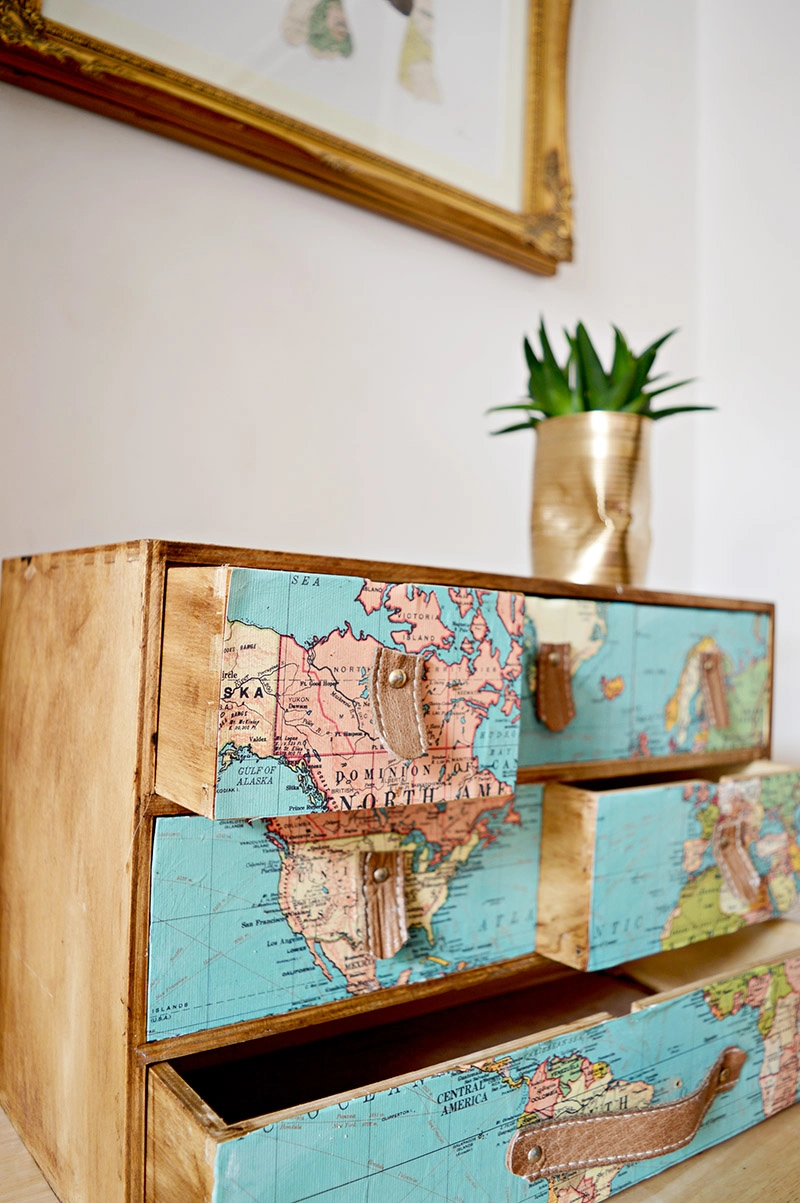 Ikea Moppe hack with maps and leather draw pulls. Great look for those with wander lust.