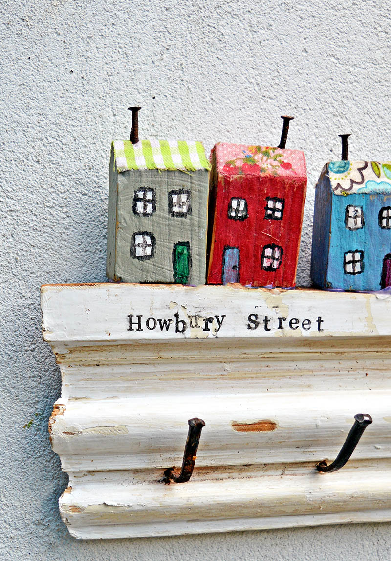 Make a cute wall key holder out of scrap wood from your house and stamp your street name on the rack.  For a unique cute quirky and useful key rack.