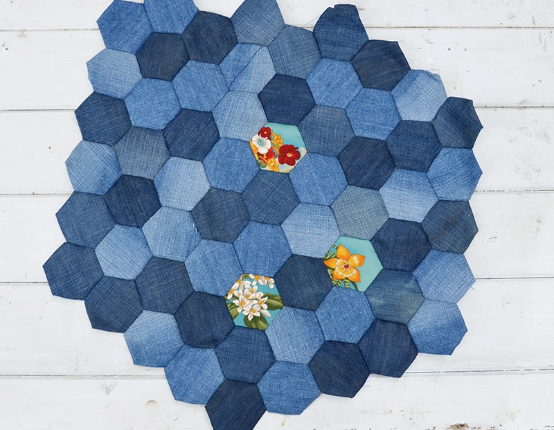 Denim patchwork hexagons using English paper piecing method for a seat cover.