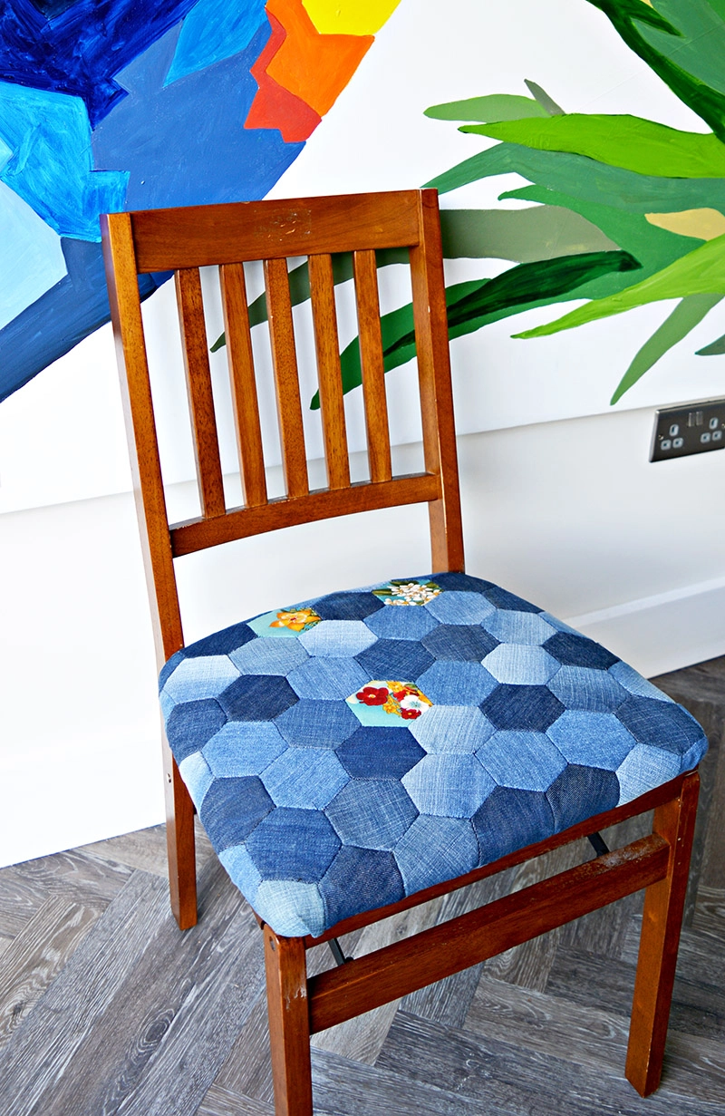 Denim patchwork chair made from upcycled old jeans using hand sewn denim hexagons.  Full tutorial.