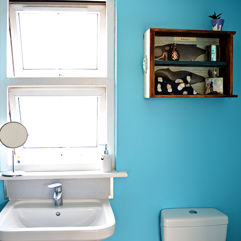 Using upcycled drawers to make a really handy but sweet wall cabinet for a bathroom.