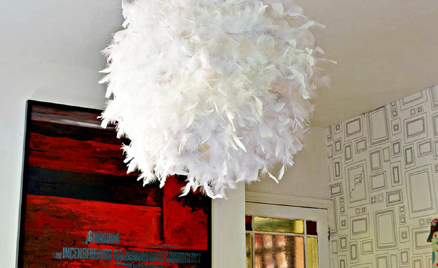 Make your own gorgeous DIY feather lampshade. This simple IKEA hack will add a touch of glamour to any room.