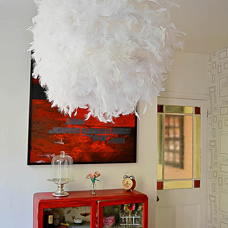 Make your own gorgeous DIY feather lampshade. This simple IKEA hack will add a touch of glamour to any room.