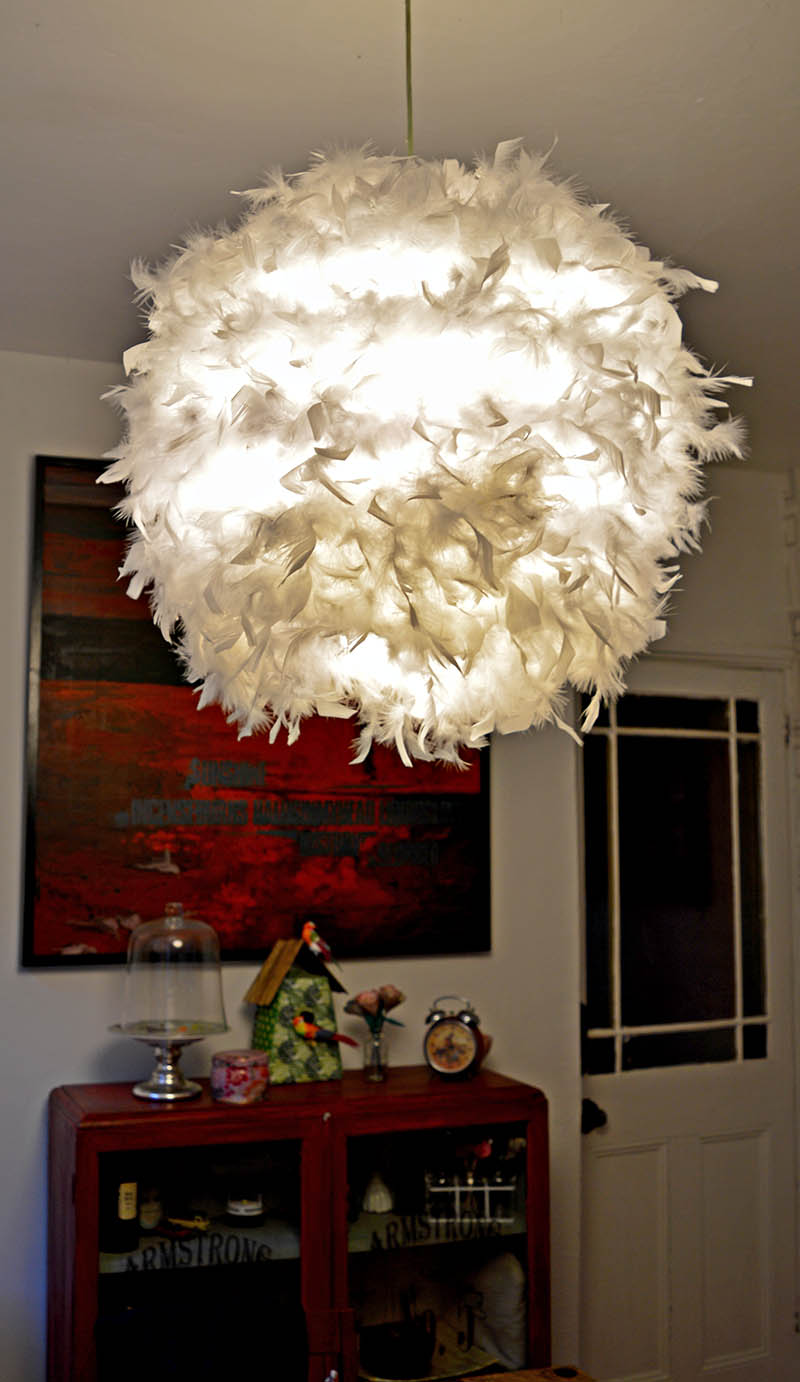 DIY feather lampshade.  This simple IKEA hack (Regolit)  will add a touch of glamour to a room.  It also provides a lovely soft light effect.