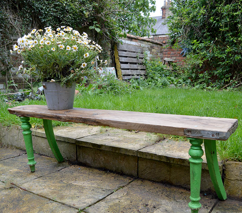 Scaffolding board furniture DIY garden bench using an old chair and board from a dumpster.