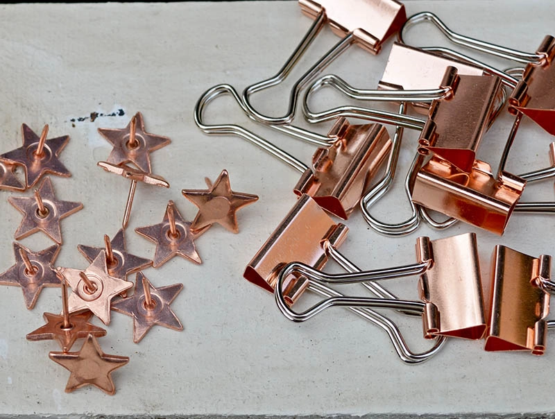 Push pins and copper bulldog clips.