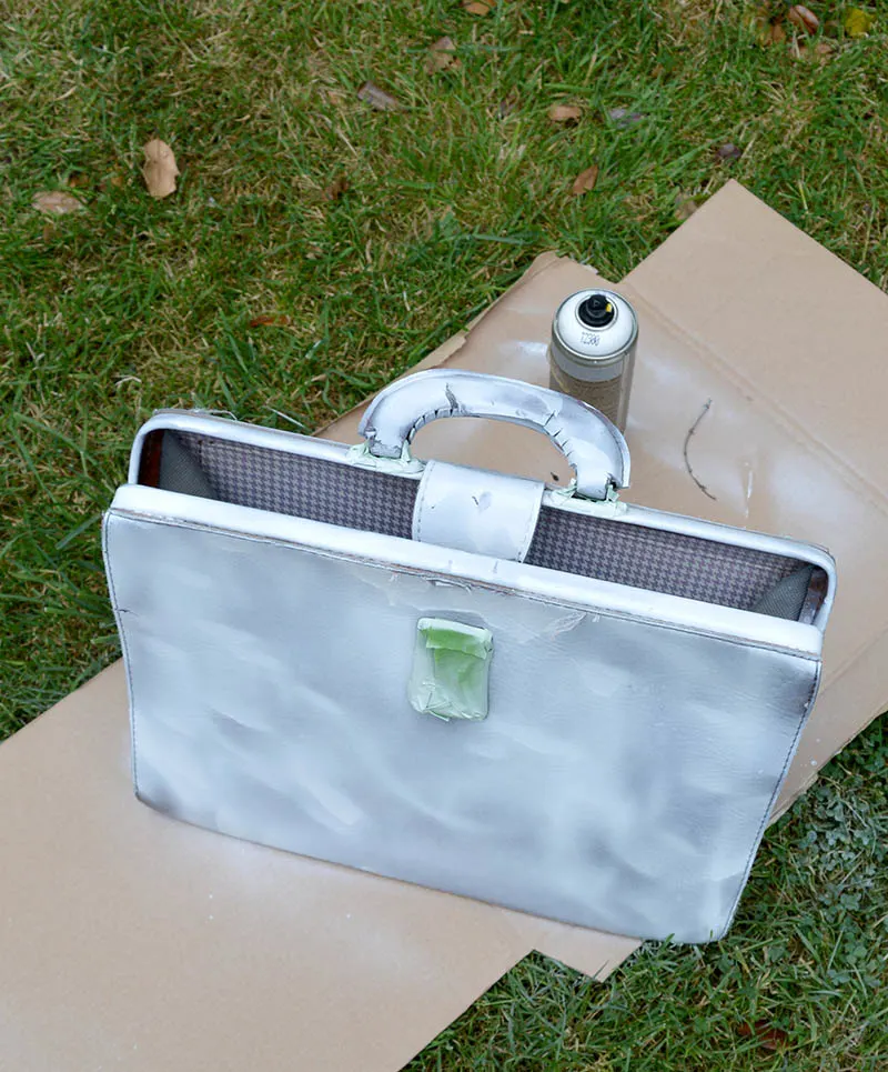 Spray painting leather bag with white primer