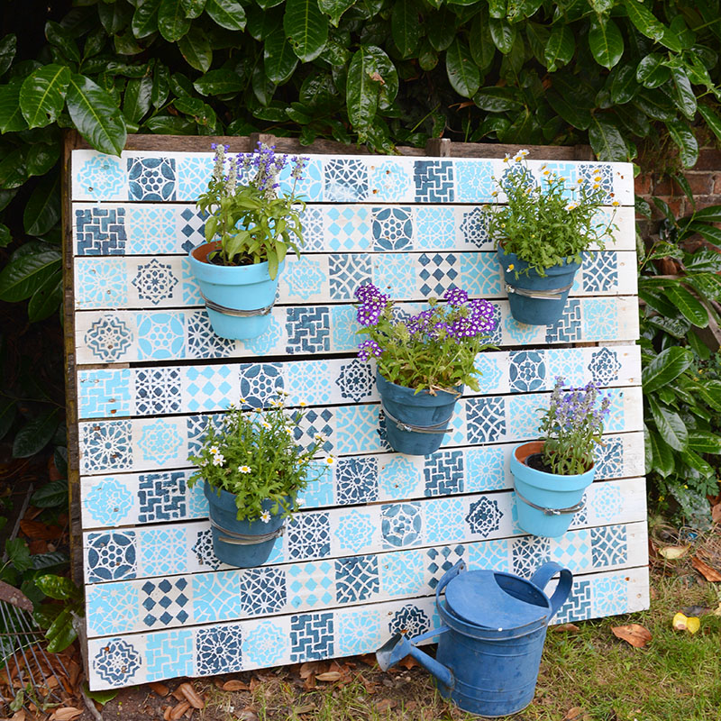 Add some colour to your garden with this stylish affordable Moroccan tile painted pallet wood planter. It's really simple to do full step by step tutorial.