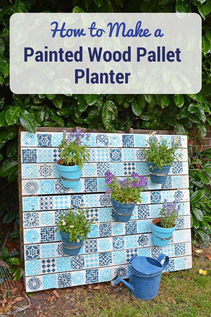 Upcycle an old wood pallet with a moroccan tile stencils, to make an bright painted wood pallet wall planter to add colour to your garden.