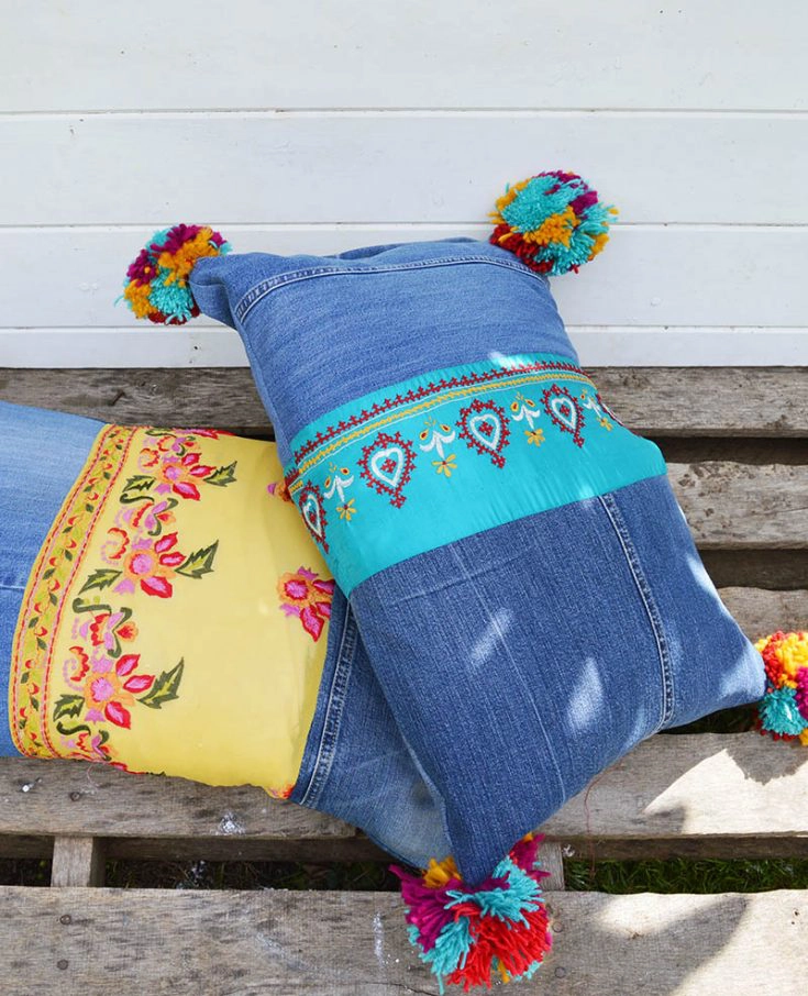 Finished upcycled boho jeans pillows with vintage sari trim and pom poms