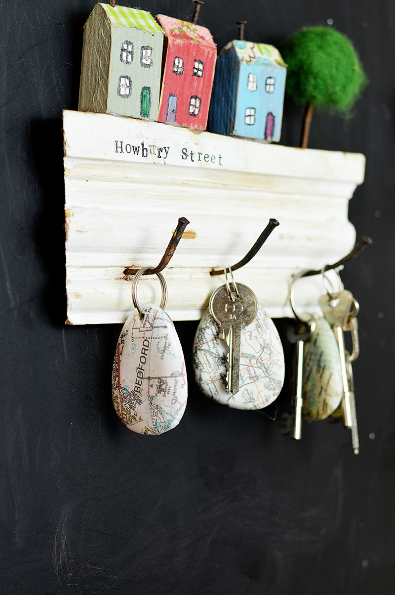Print street maps onto stones and pebbles using Mod Podge to create a unique map rock keychain.  Makes for a lovely personalized gift.