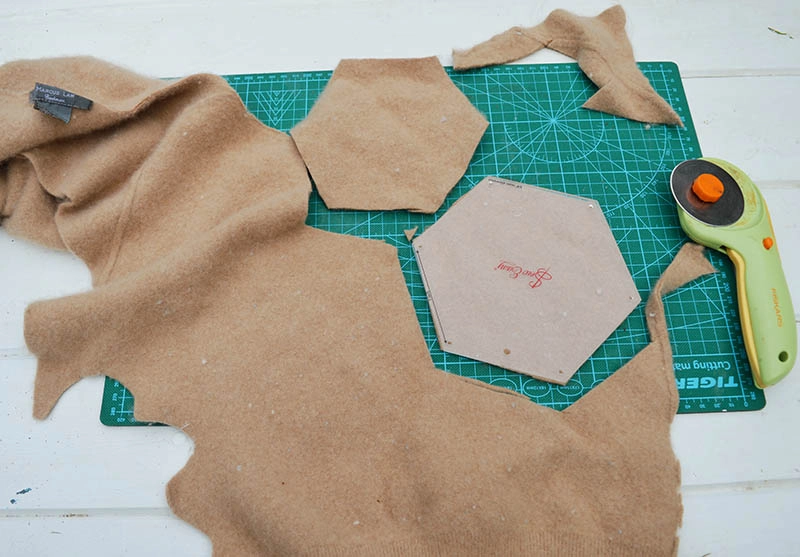 Cutting felt hexagons from upcycled sweaters