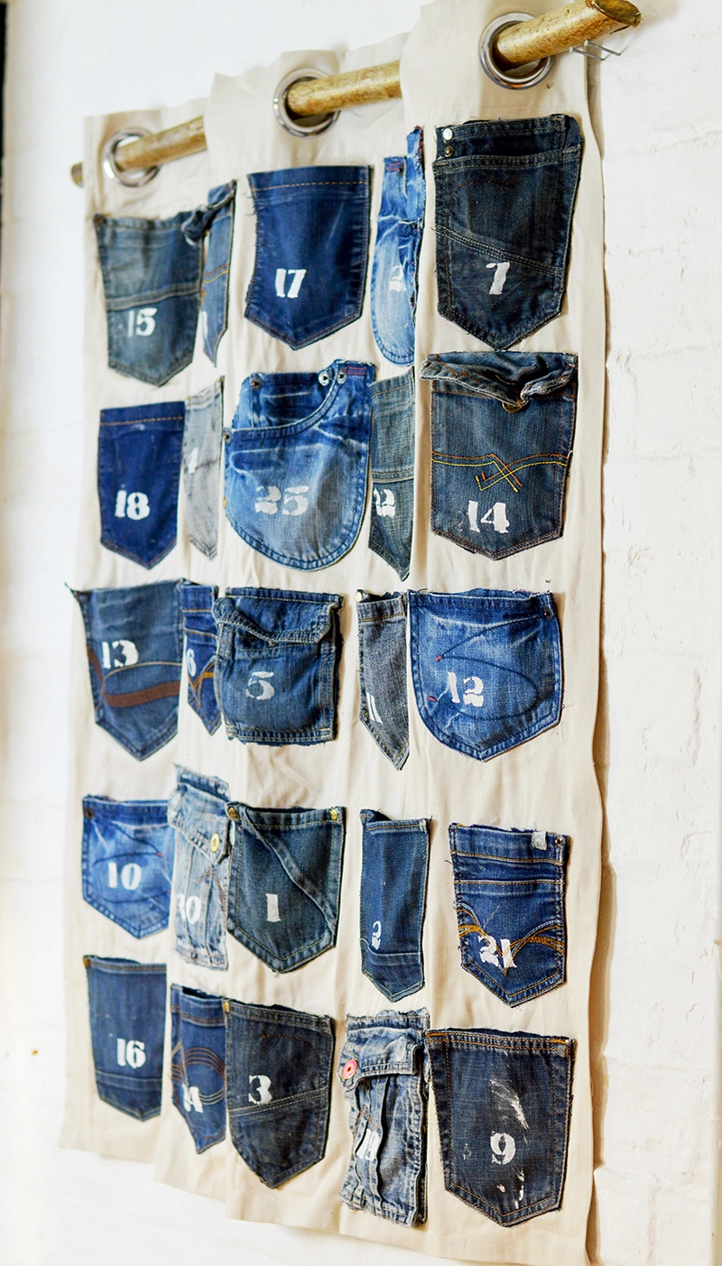 Rustic, industrial homemade advent calendar.  This is easy to make Christmas craft from recycled jeans pockets and is a no-sew project.
