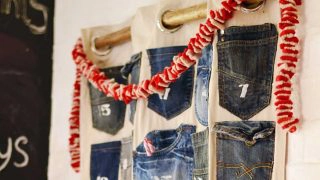 Rustic, industrial homemade advent calendar. This is easy to make Christmas craft from recycled jeans pockets and is a no-sew project.