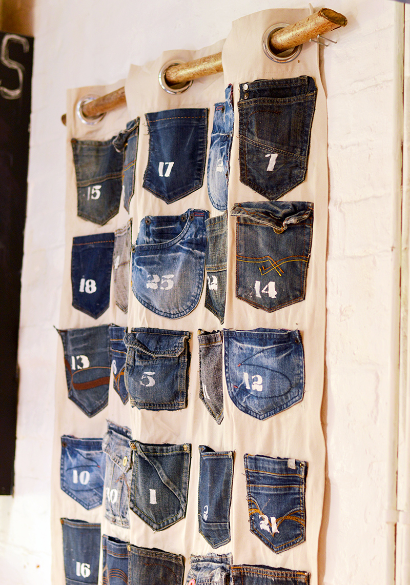 Rustic, industrial homemade advent calendar. This is easy to make Christmas craft from recycled jeans pockets and is a no-sew project.