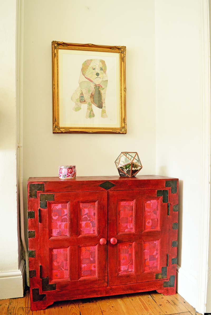 Cabinet upcycle using Annie Sloan Emerpor's Silk red chalk paint and Marimekko paper napkin decoupage.