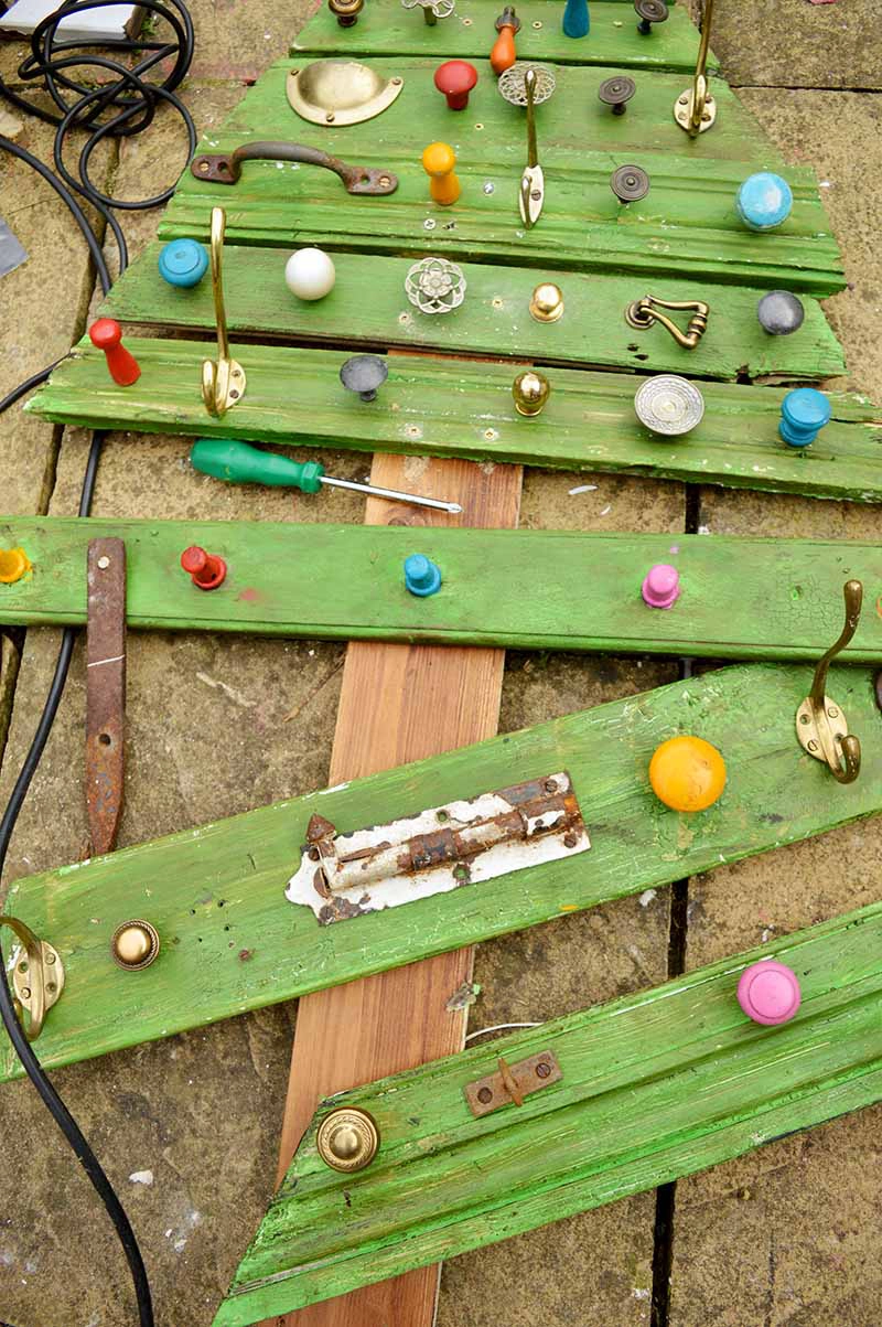 Screwing branches to wood DIY wooden christmas tree 