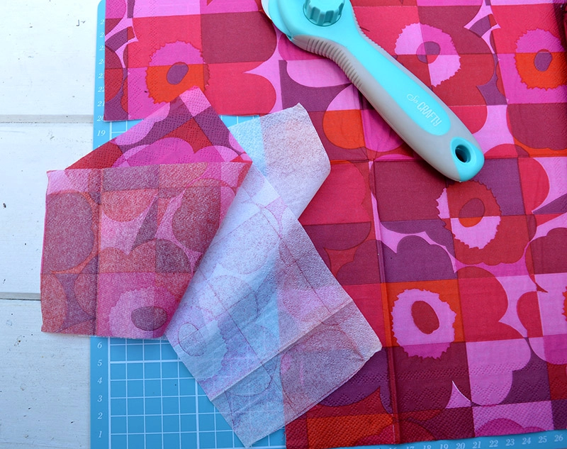 Cutting Marimekko Napkins for decoupage cupboard