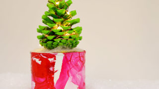 Illuminated DIY mini pine cone Christmas tree for you desk.