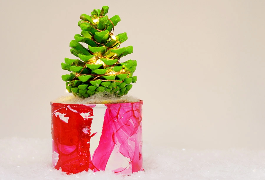 Illuminated DIY mini pine cone Christmas tree for you desk.